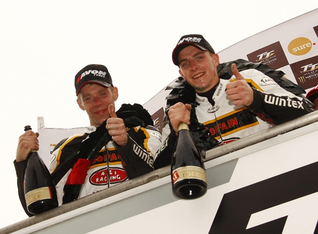 Tom and Ben Birchall on the Sure Sidecar podium at the 2012 Isle of Man TT (Mark Wally Walters)